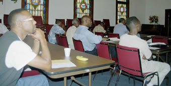 Men attend inspirational workshop.